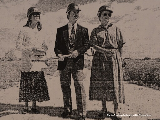 Black and white newspaper image of Seastrom family surveying land in Idaho